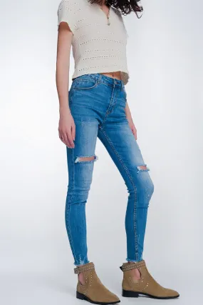 Mid denim super skinny jeans with holes in the knees